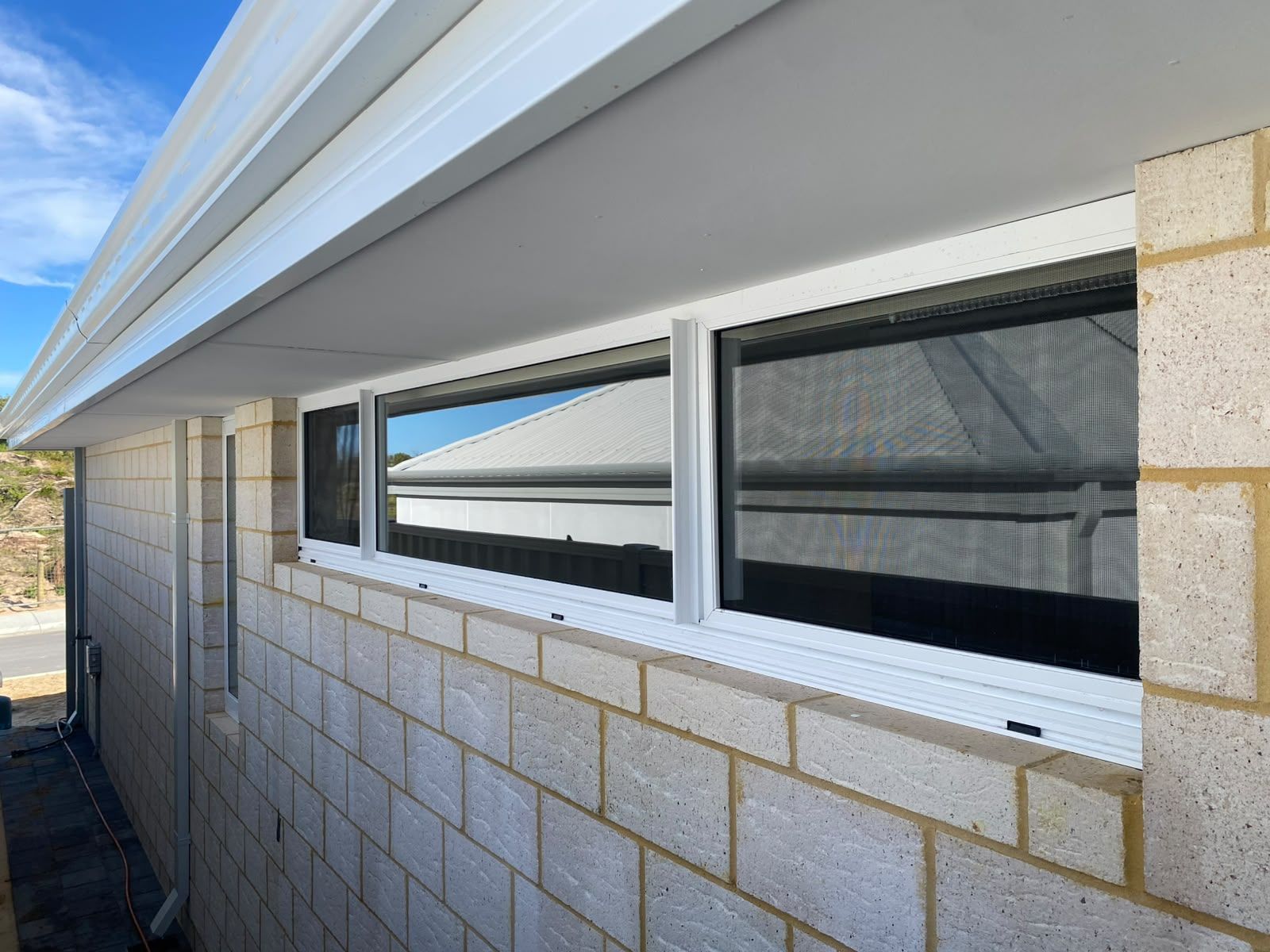 Cleaned exterior windows on a brick house
