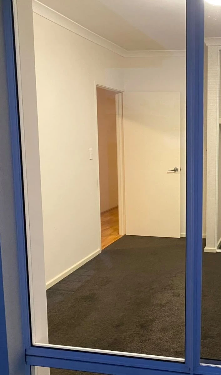 Cleaned interior window overlooking a hallway
